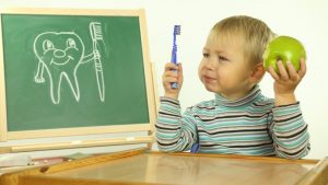 kid learning about brushing